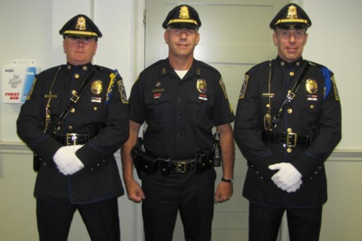 Detective Rodden (left) and Officer Jones (right) of the Honor Guard with newly promoted Sergeant Hatch.