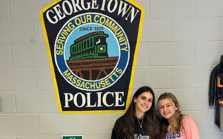 Georgetown Middle High School seniors Isabelle Gondella and Olivia Hiltz painted the Georgetown Police Department patch on the w